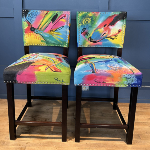 Two chairs painted by artist Picardo