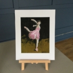 A large digital print of Ballerina dressed in pink costume.