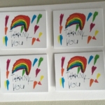 Four rainbow themed thank you cards.