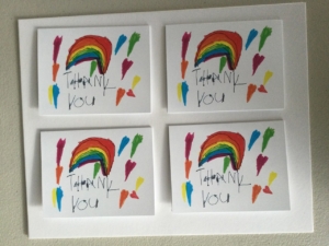 Four rainbow themed thank you cards.