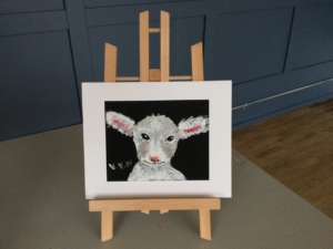 A small digital print of a sheep or lamb.