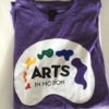 Arts in motion palette logo printed on Gildan Softstyle violet-hue colored shirt.