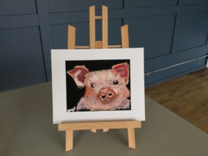 A small digital print of a pig.